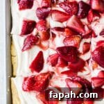 35 Gluten-Free Valentine’s Day Desserts to Delight Your Loved One 7 A three-layer sheet pan cake with coconut whipped cream and roasted strawberries on top.