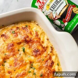 Cajun Scalloped Potatoes Recipe with Spicy Cheesy Gratin 7 close-up of Cajun scalloped potatoes in a baking dish