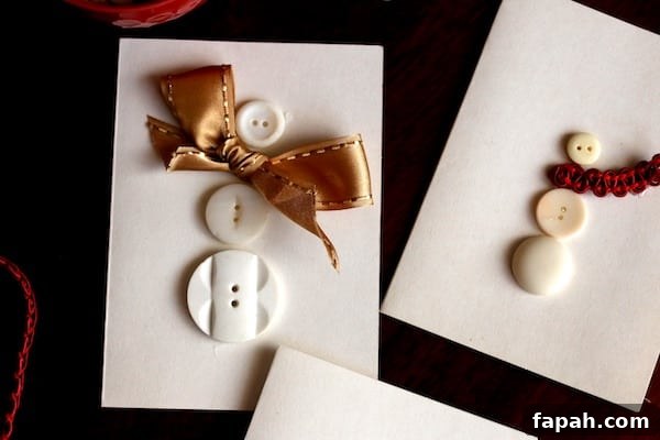 close up button snowman gold bow