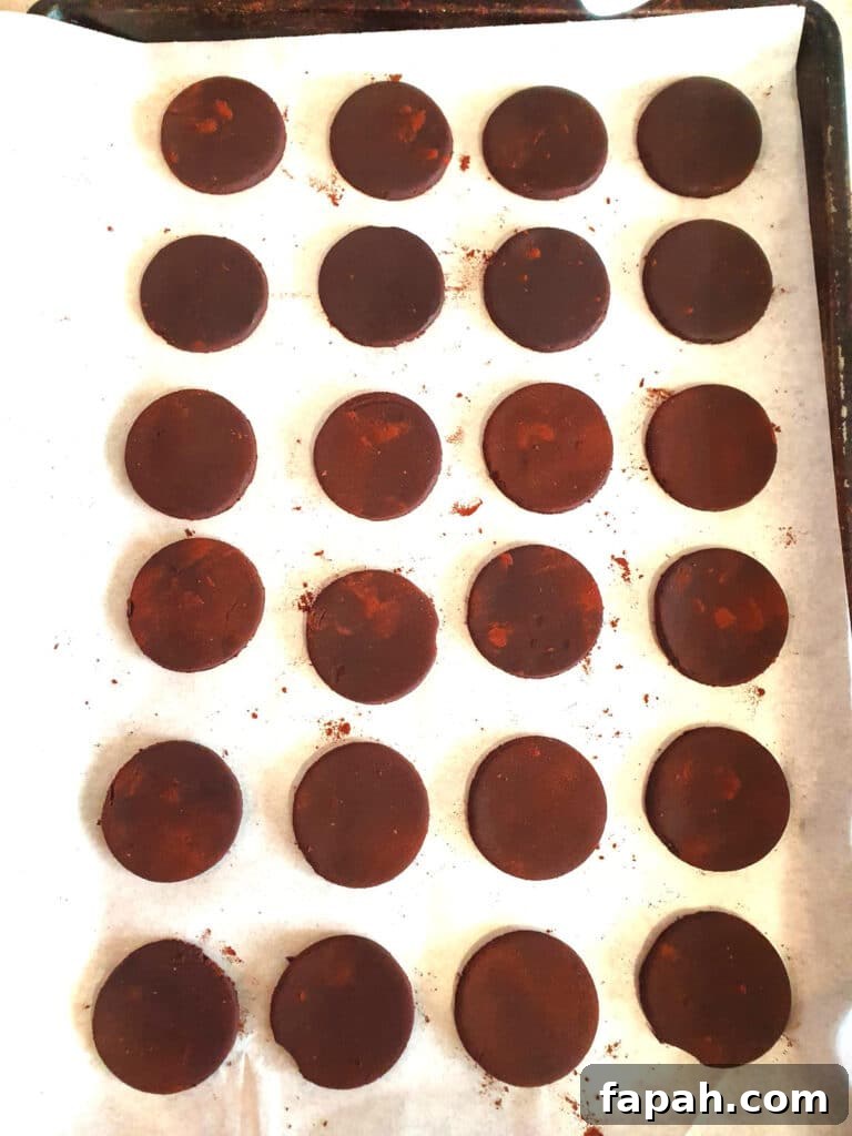 How to Make Homemade Oreo Cookies from Scratch 17 unbaking cookies on a baking tray lined with baking paper, ready to put in the oven, spaced fairly close togher, aboutr ½ inch appart.