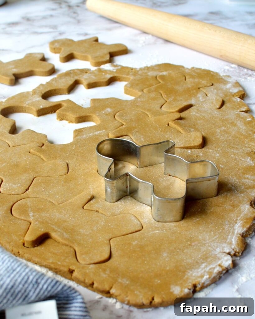 Soft Gluten-Free Gingerbread Cookies Recipe for Tender Bites 3 Gingerbread dough getting cut into gingerbread men