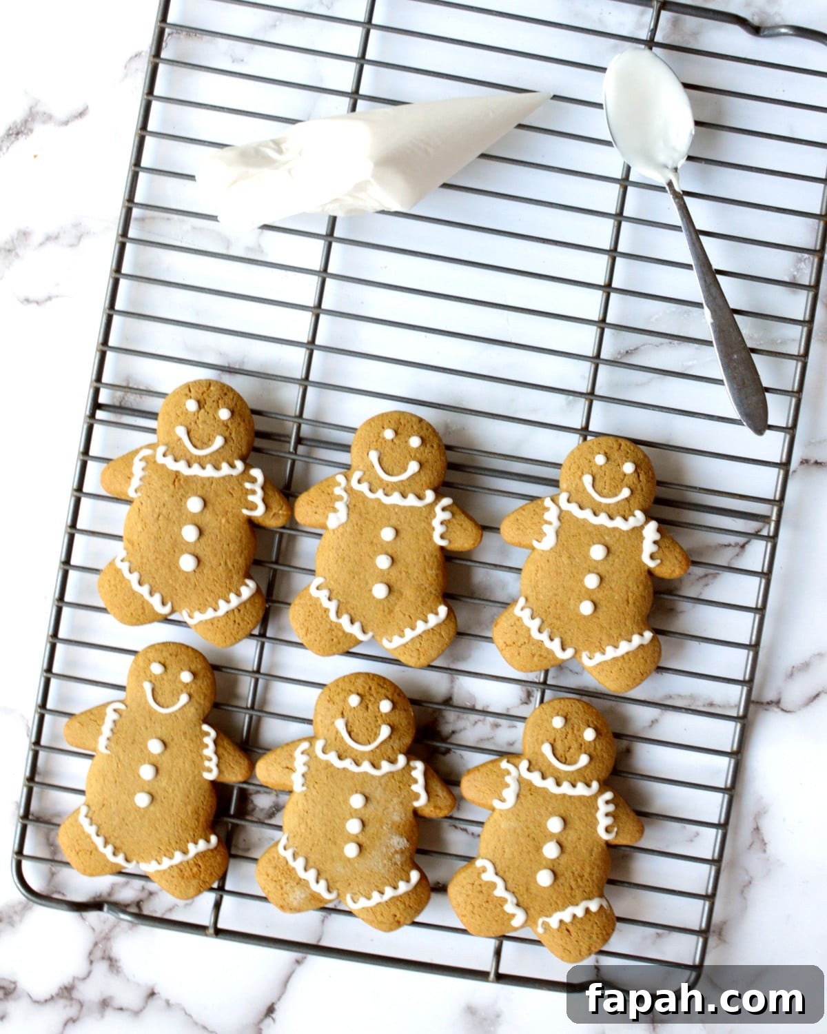 Soft Gluten-Free Gingerbread Cookies Recipe for Tender Bites 4 a cooling rack of gingerbread men