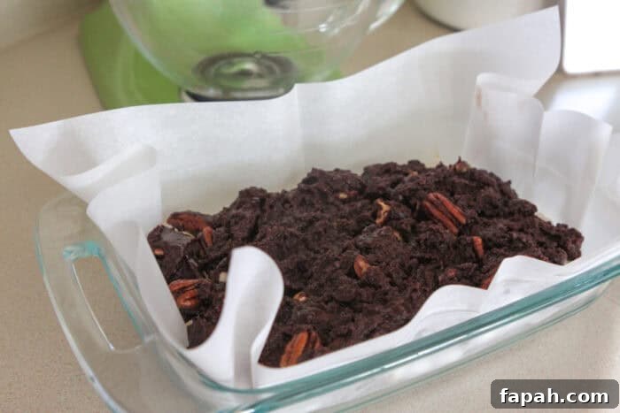 Decadent Caramel Pecan Brownies with Gooey Center 7 brownie batter added to baking dish