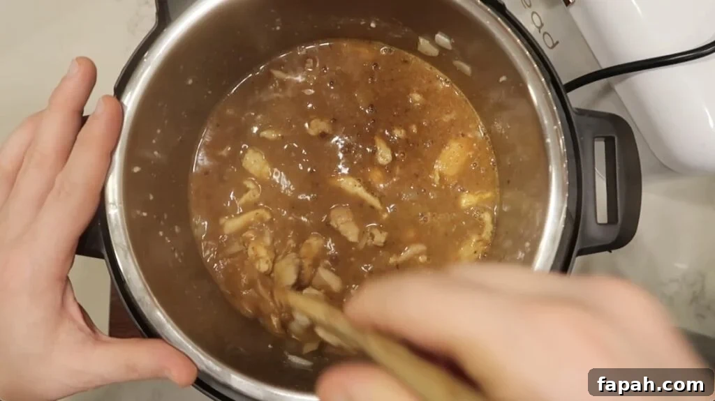 Stirring the spices into the broth