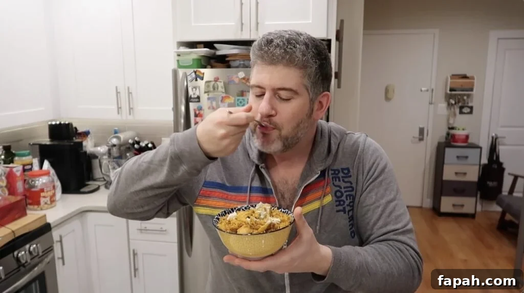Man trying Chicken Biryani