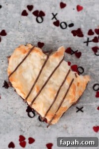 a coconut macaroon heart with a bite taken out