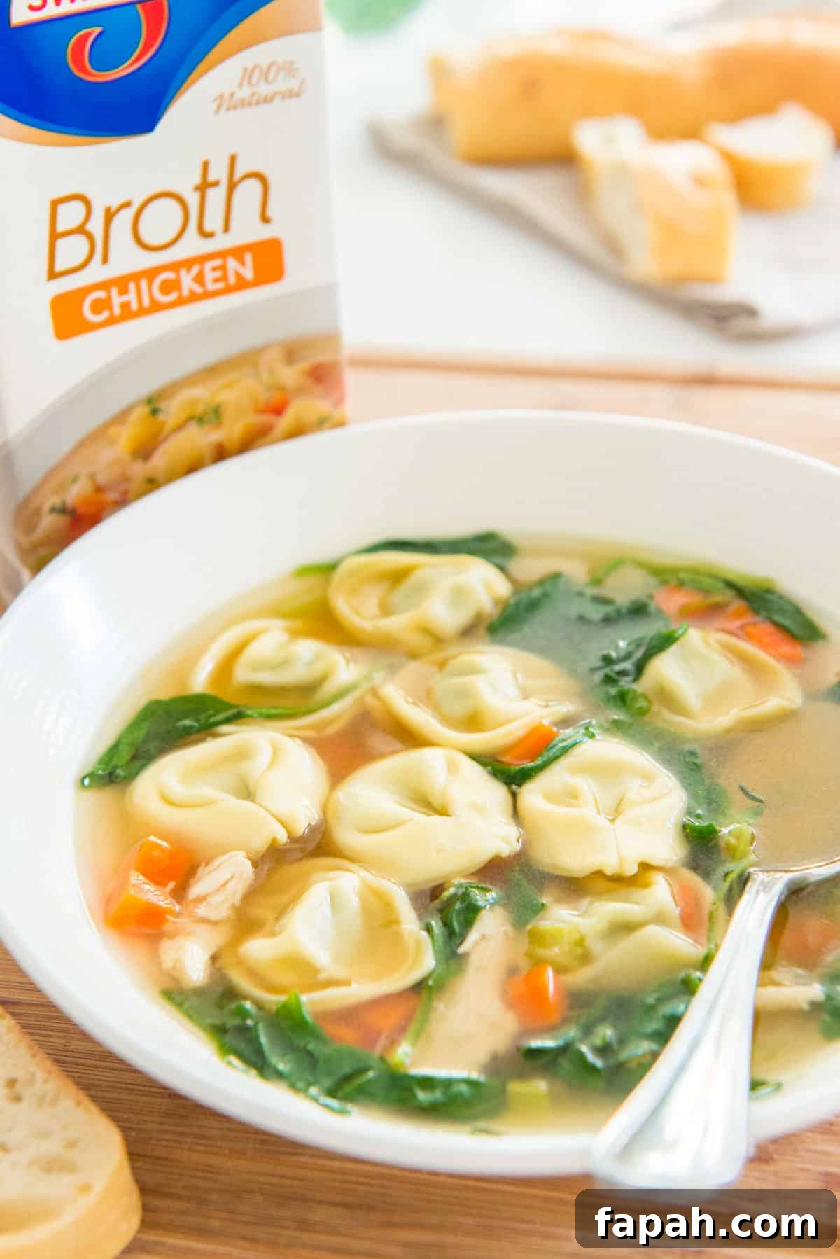 Creamy Spinach Tortellini Soup Recipe for Cozy Weeknights 11 Spinach Tortellini Soup in White Bowl on Wooden Board