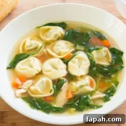Creamy Spinach Tortellini Soup Recipe for Cozy Weeknights 12 Chicken Spinach Tortellini Soup in Bowl on Wooden Surface