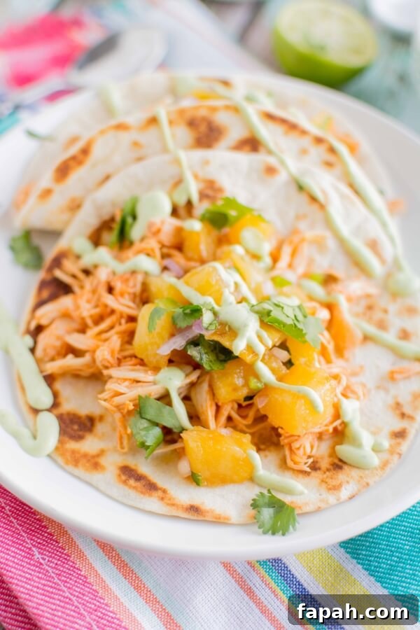 Slow Cooker Sriracha Chicken Tacos