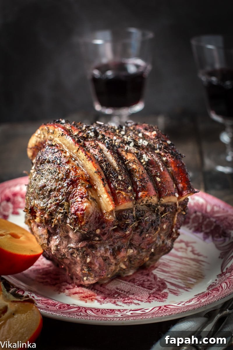 Cooked roast on a serving platter with an opened persimmon