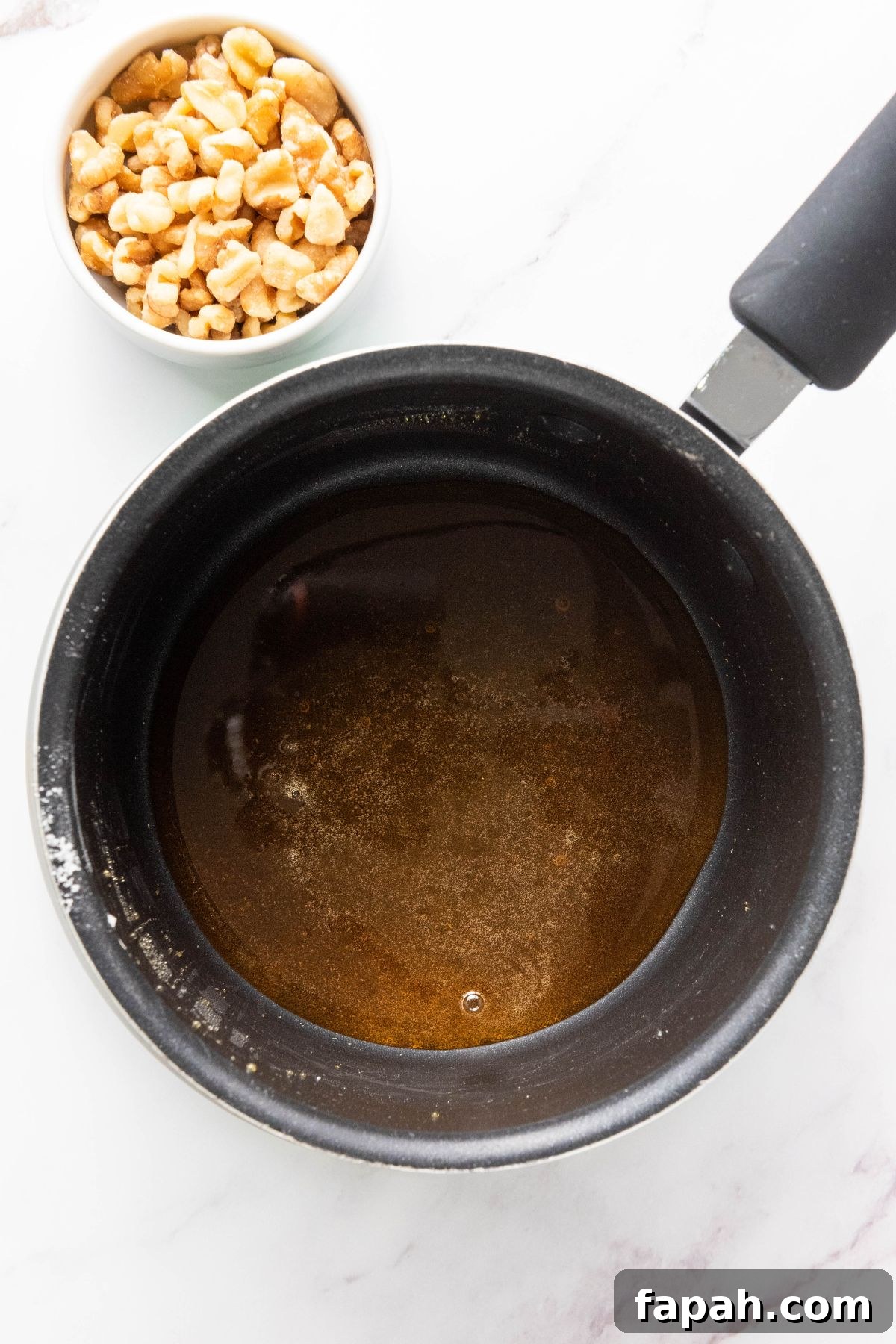 Baked Brie with Honey and Pecans: Warm Party Appetizer 5 Sugar melted in a saucepan.
