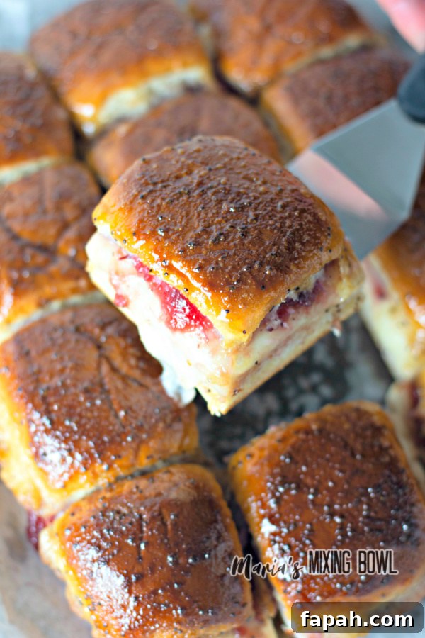 turkey cranberry sliders on a metal spatula
