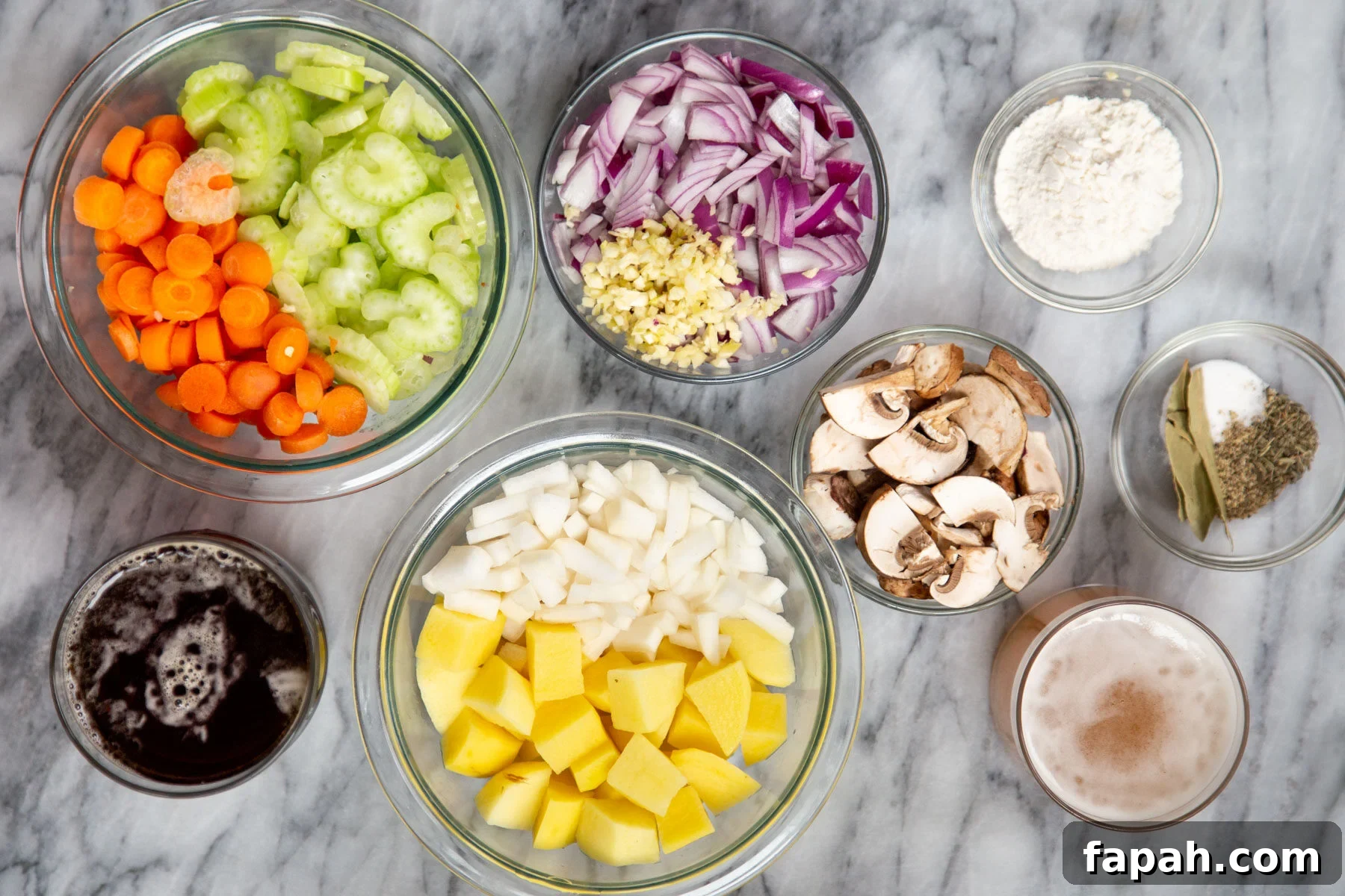 ingredients for making vegan Irish stew on a marble countertop 