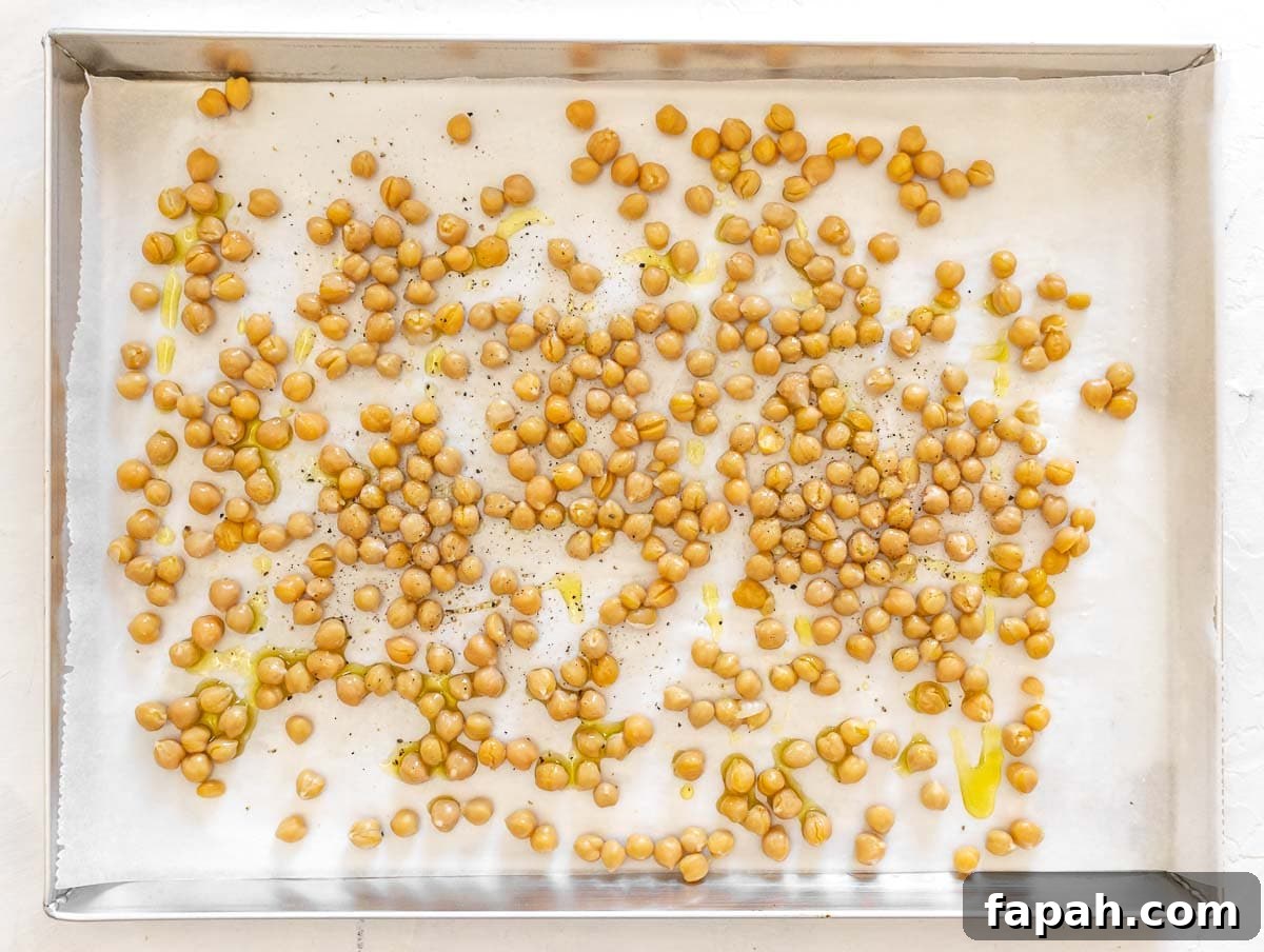 seasoning the chickpeas with oil, salt and pepper