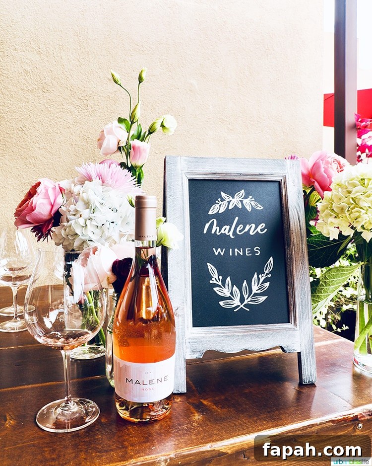 Malene Rosé bottle with flowers and wine glass
