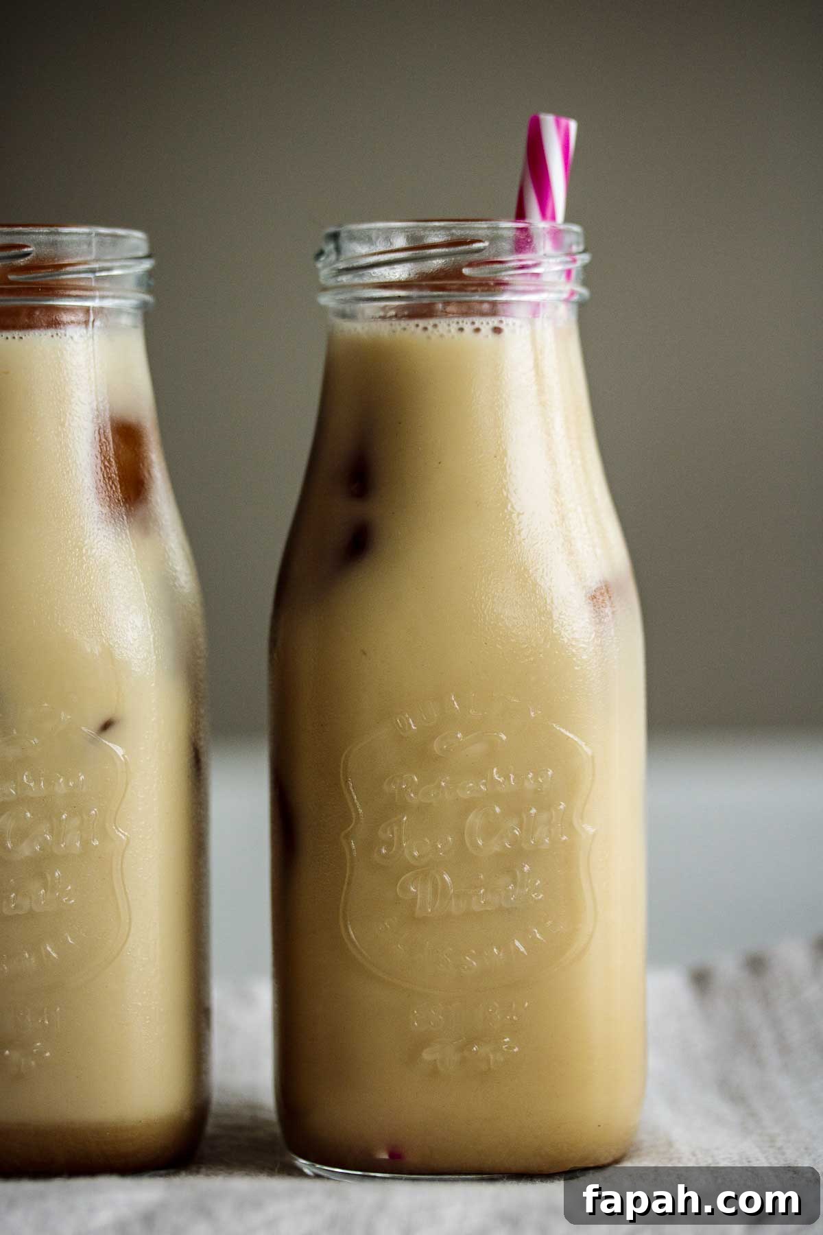 Beverages ready to drink with pink reusable straw.