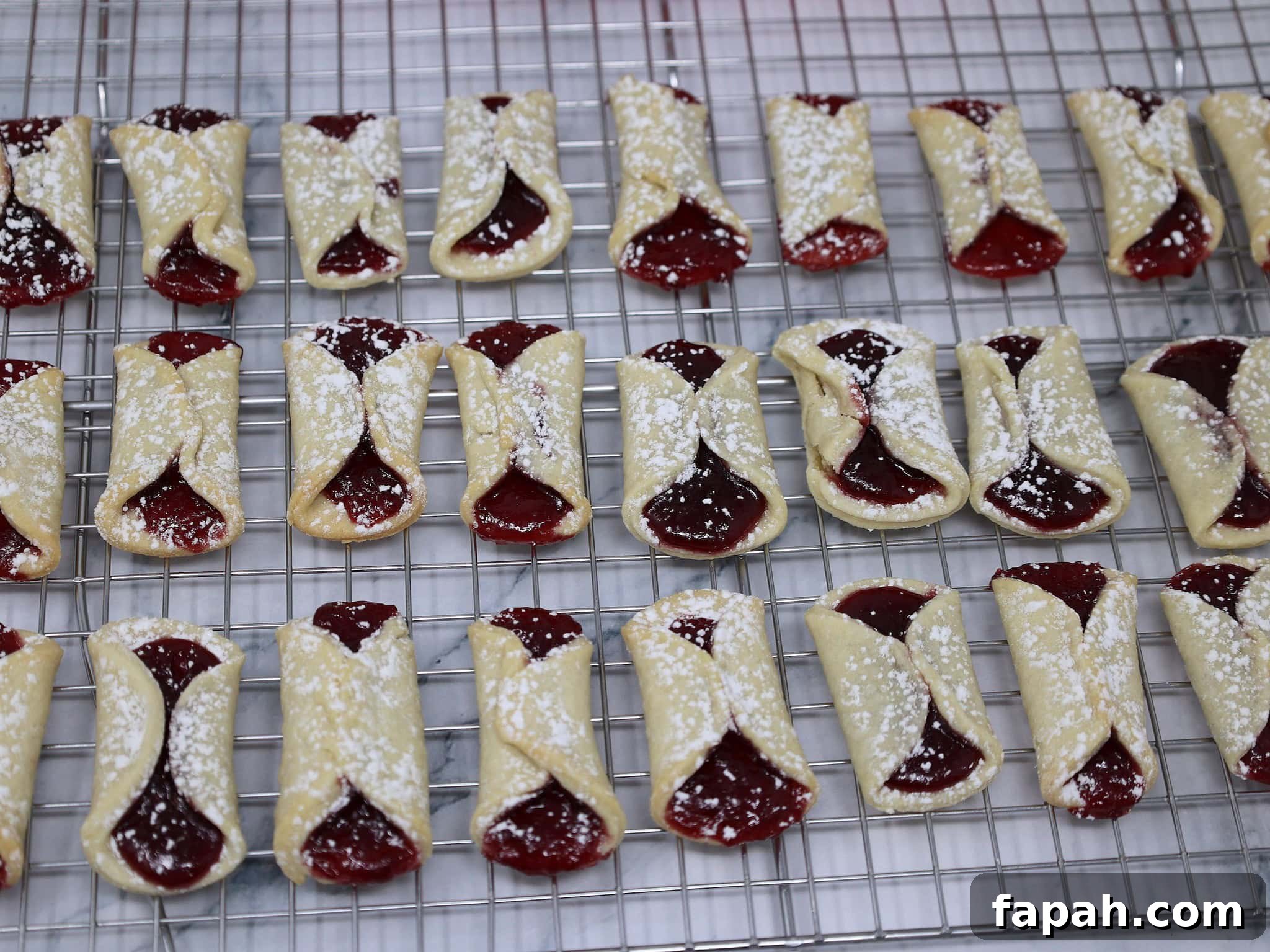 Classic Italian Pinch Cookies (Pizzelle-Inspired Biscotti) 3 italian pinch cookies on a cooling rack