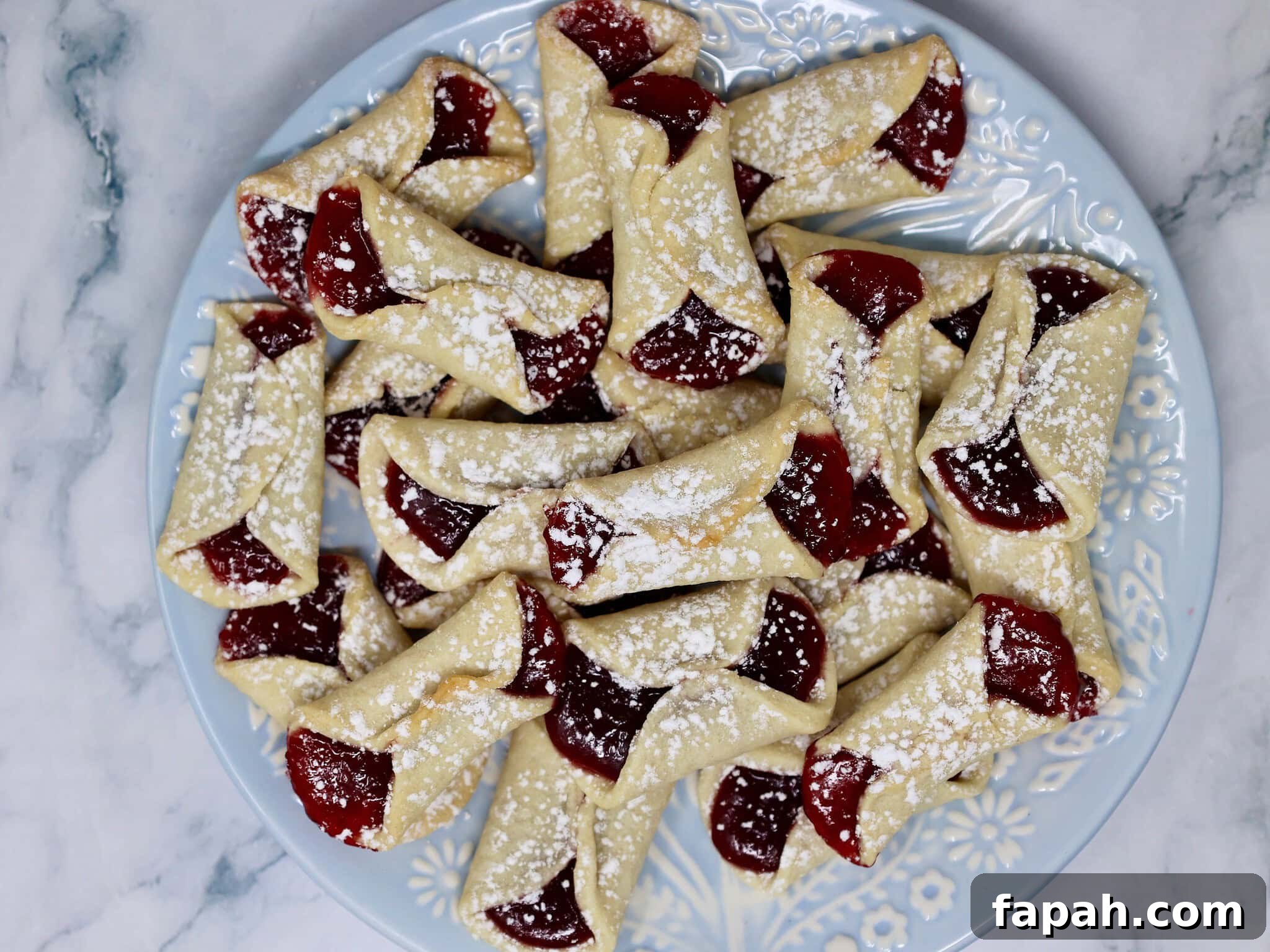 Classic Italian Pinch Cookies (Pizzelle-Inspired Biscotti) 4 italian pinch cookies with raspberry filling