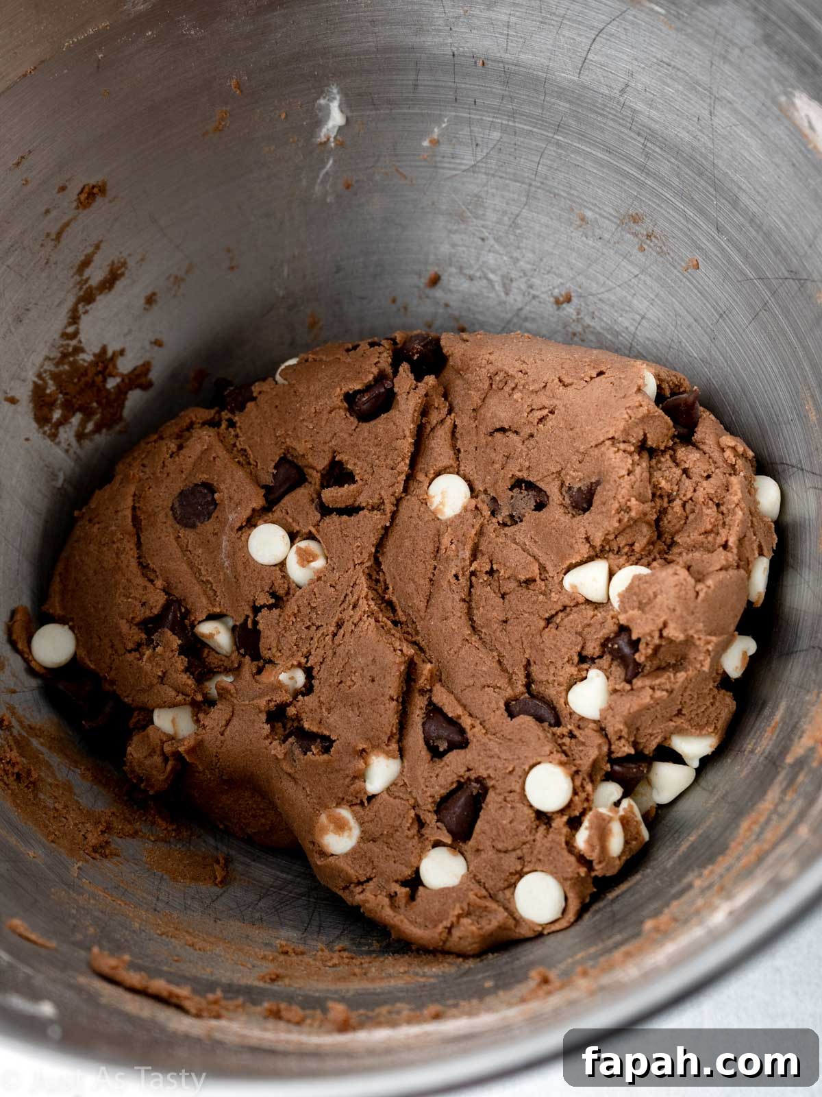 Triple Chocolate Chip Cookies — Gluten-Free Recipe 8 Chocolate chip cookie dough in a bowl.
