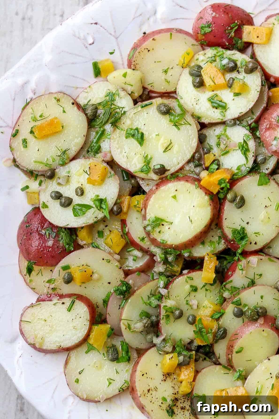 Herbed Potato Salad with Capers and Pickled Beets on a platter.