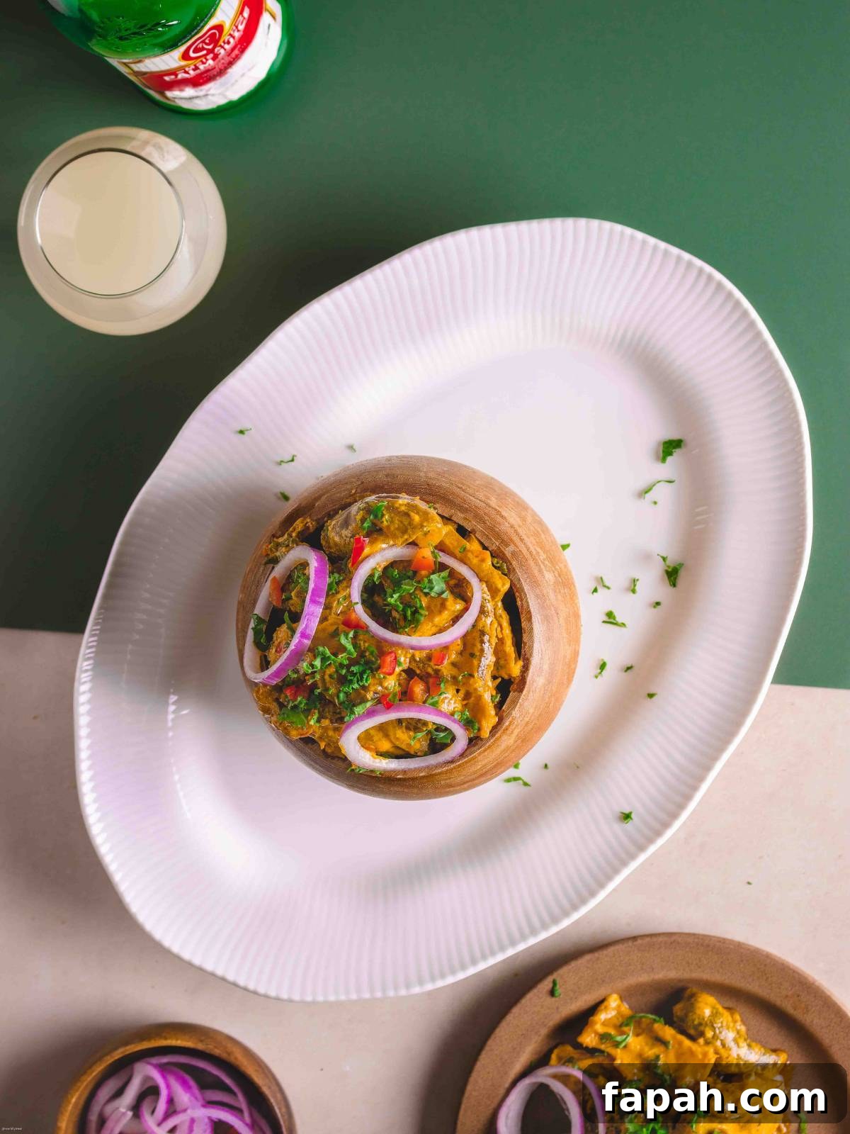 A serving of nkwobi recipe in a shallow bowl.