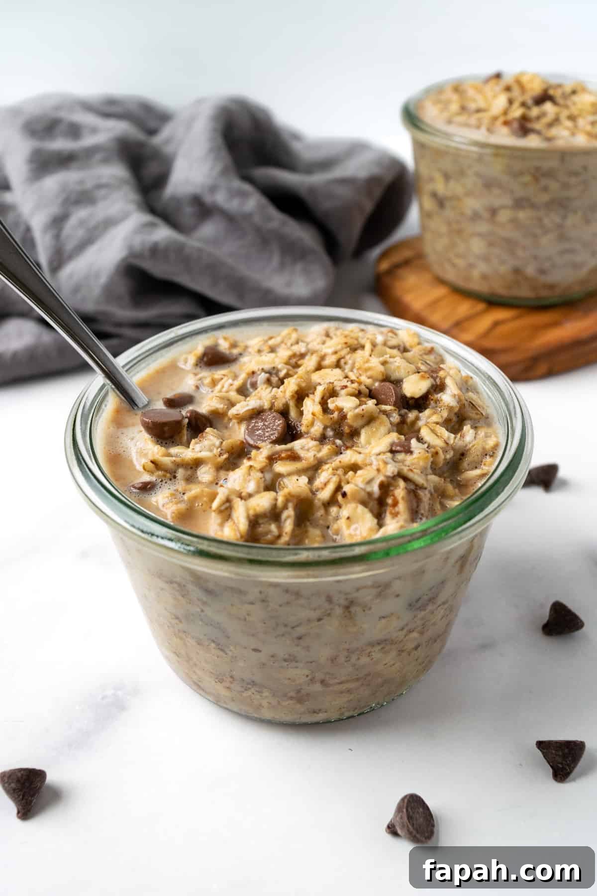 Cookie Dough Overnight Oats in a glass jar on a table.