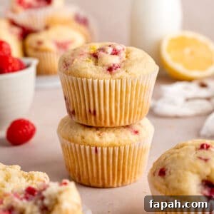 Lemon Raspberry Muffins with Zesty Glaze 16 A stack of lemon raspberry muffins.
