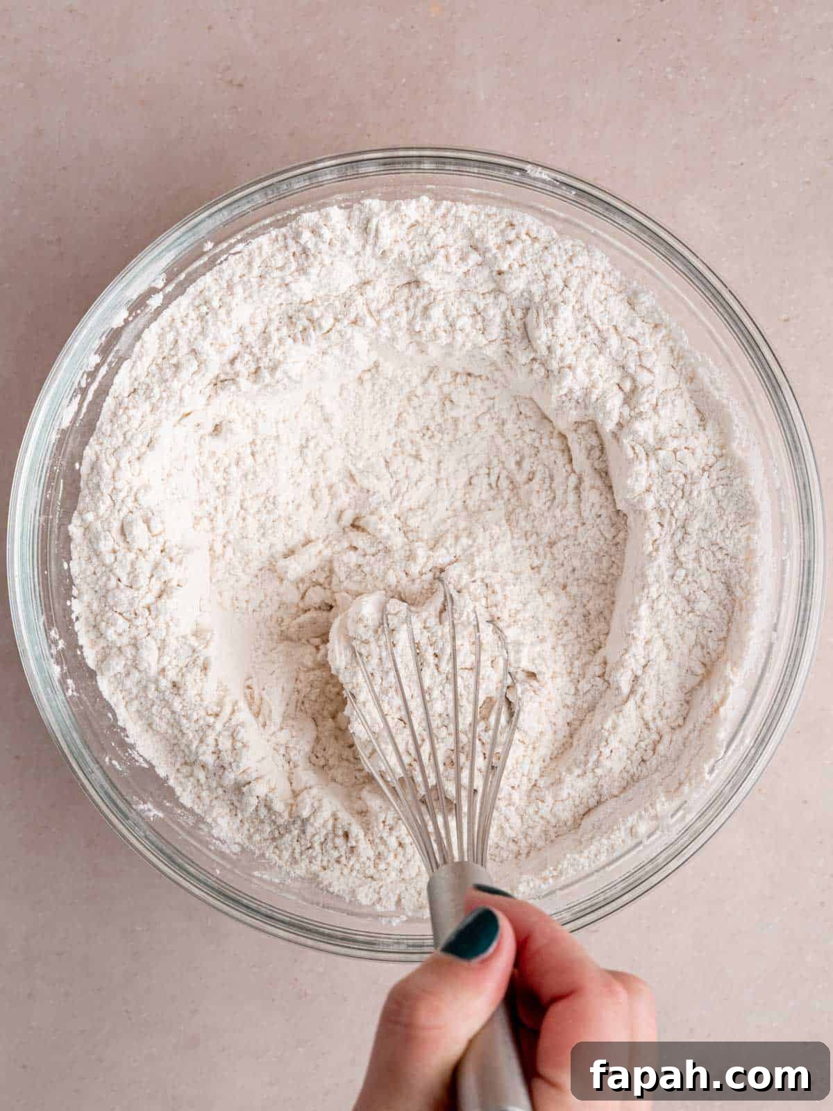 Lemon Raspberry Muffins with Zesty Glaze 4 Whisking flour, baking powder, and salt in a bowl.