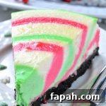 Colorful piece of Christmas cheesecake in a plate.