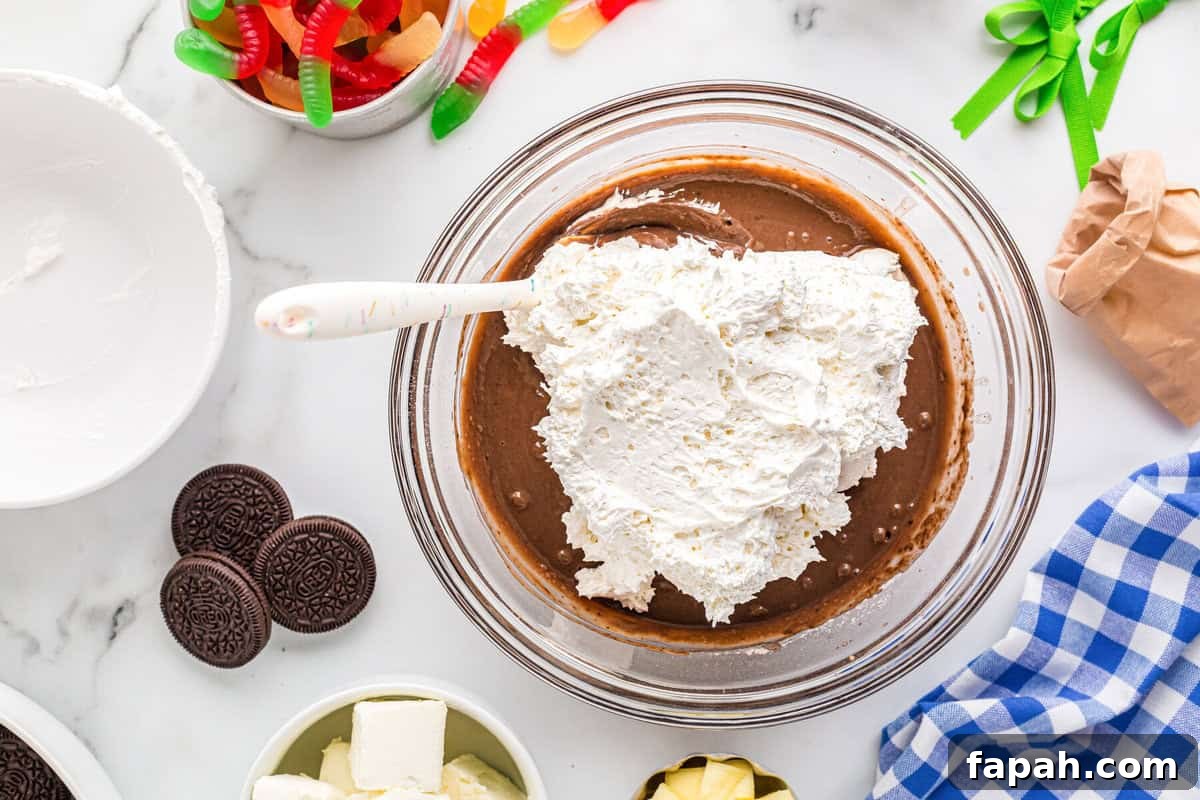 Chocolate pudding mixture with whipped topping mixed in.