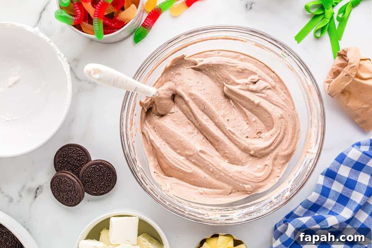 Fluffy chocolate pudding mixture in a glass bowl.