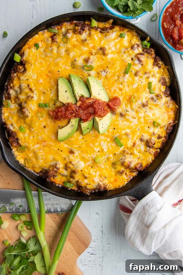 an overhead shot of a cast iron skillet with tamale pie