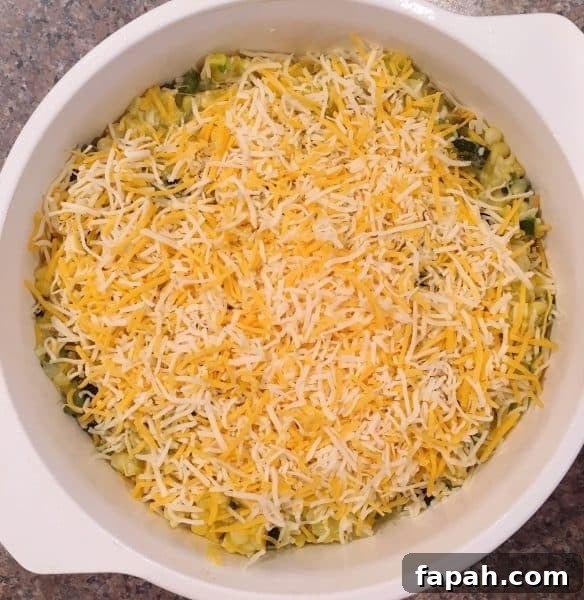 Green and Gold Squash Casserole topped off with cheese