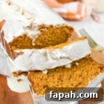 sliced pumpkin bread with white chocolate glaze