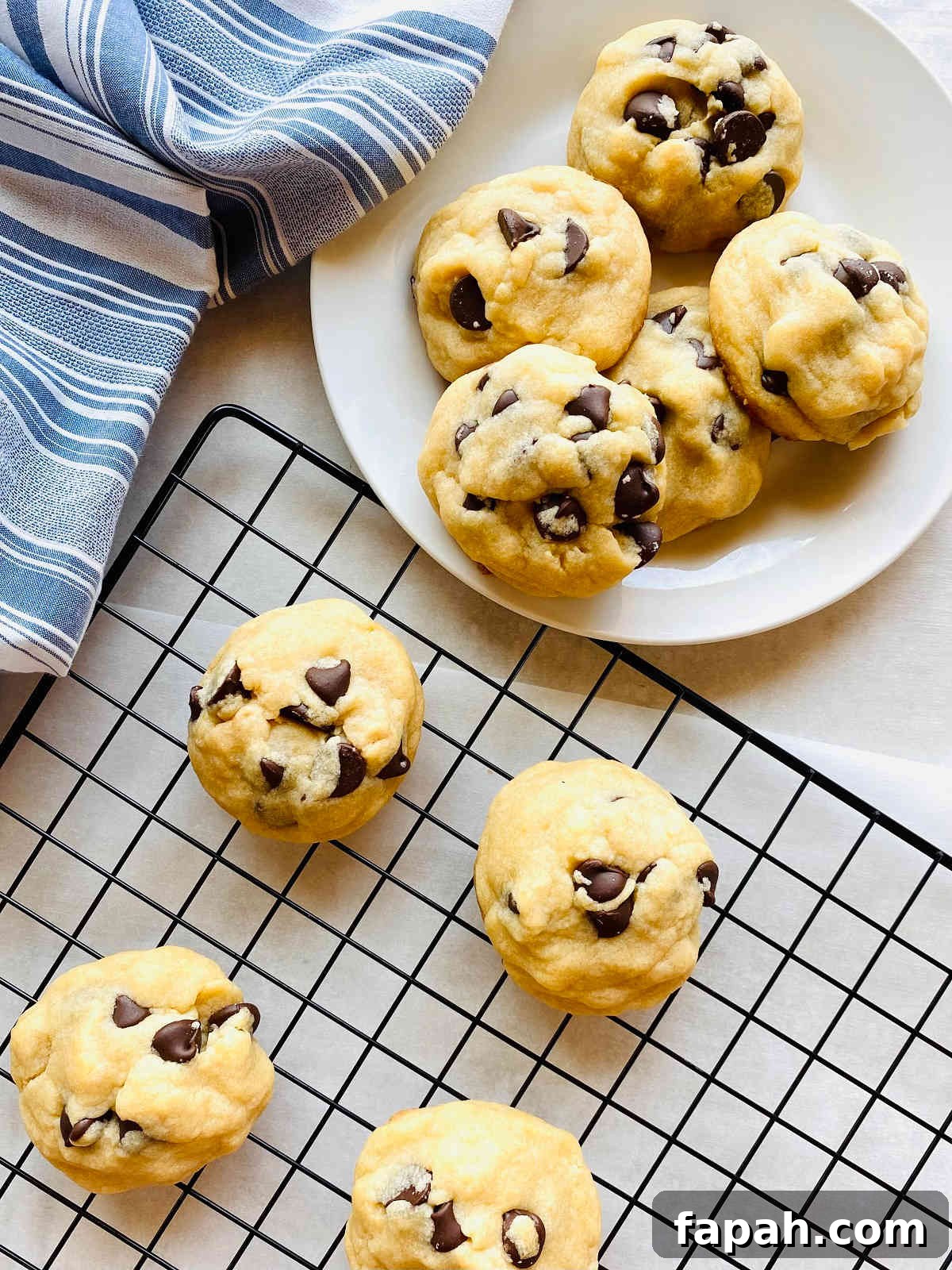 Chocolate Chip Cookies Made Without Brown Sugar: Soft & Crispy Recipe 7 chocolate cookies without brown sugar on a plate next to cooling rack of cookies