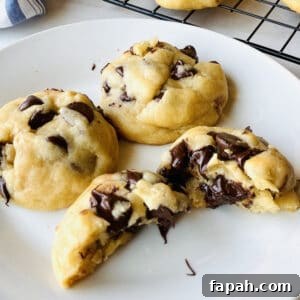 chocolate chip cookies without brown sugar and one cut in half oozing chocolate