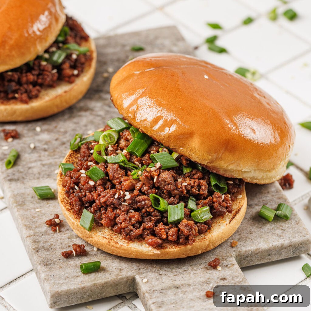 two korean sloppy joes on cutting board