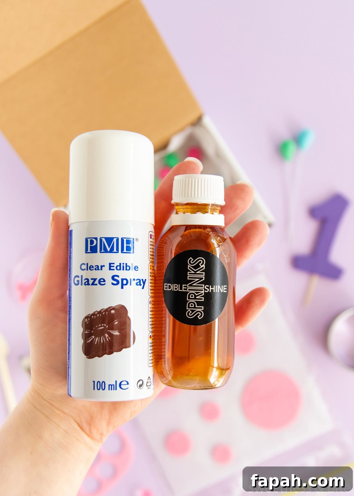 Storing Fondant Decorations: Tips to Keep Cakes Flawless 11 A bottle of Sprinks confectioner's glaze and a can of PME glaze spray.