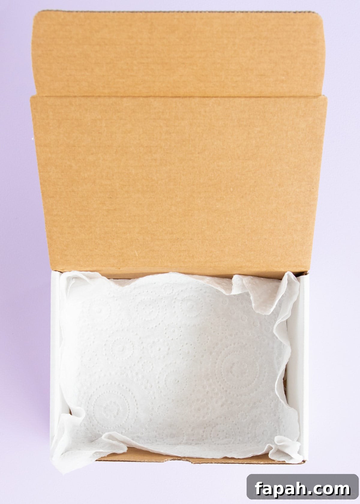 Storing Fondant Decorations: Tips to Keep Cakes Flawless 7 A box lined with a paper towel.