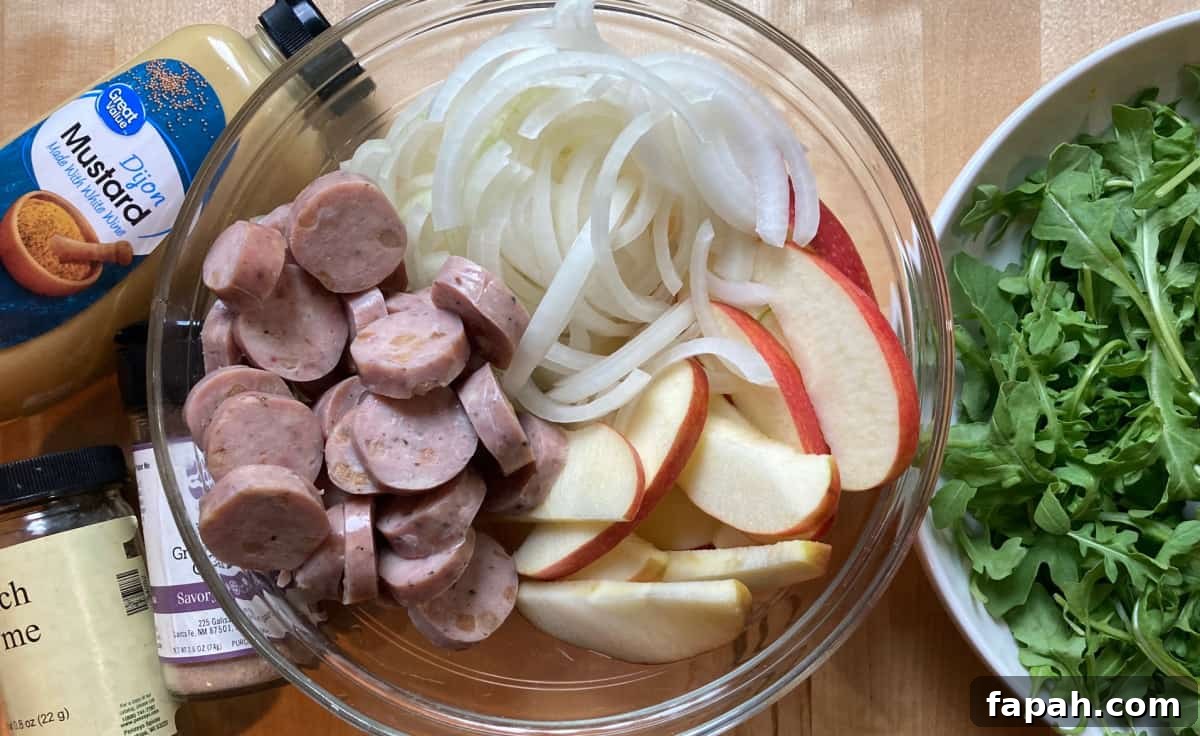 Sliced chicken sausage, apple, onion, mustard, thyme, granulated garlic, bowl of arugula
