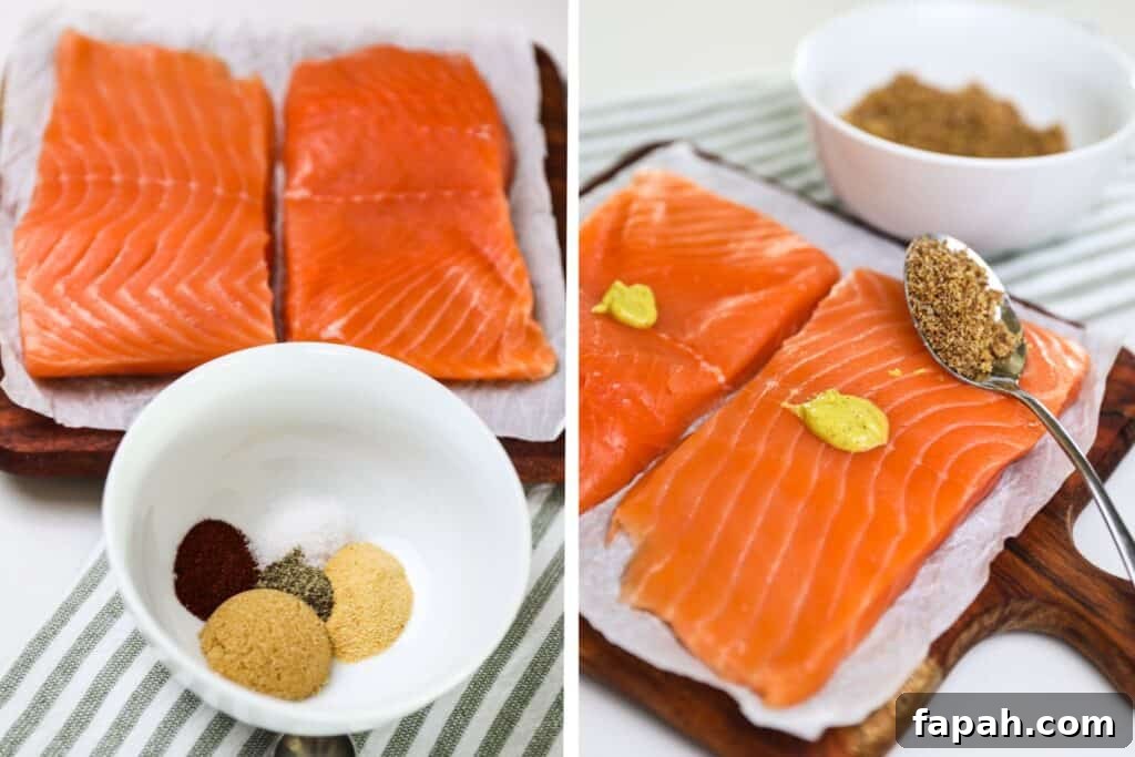 Sweet and Spicy Salmon in the Air Fryer: Quick Crispy Recipe 5 Spreading mustard and then seasoning on top of raw salmon filets. prepping sweet and spicy salmon air fryer recipe.