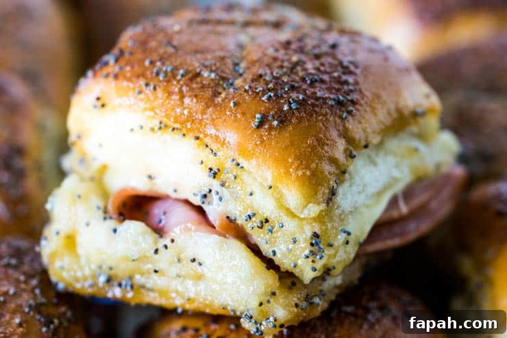 Sweet Ham & Swiss Sliders with Tangy Glaze Recipe 5 Sweet Ham and Swiss Sliders are a perfect party food and can be baked whenever you're ready to eat, so they're always hot and melty for your guests!