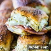 Sweet Ham and Swiss Sliders are a perfect party food and can be baked whenever you're ready to eat, so they're always hot and melty for your gue