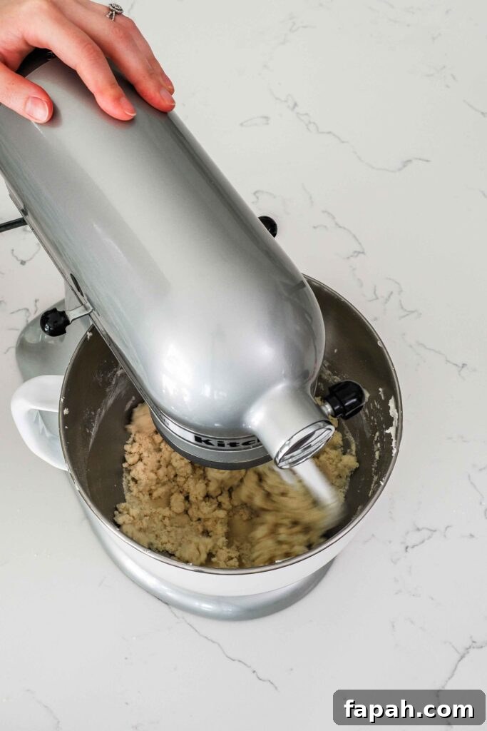 Flour is mixed into creamed butter and sugar and makes a crumbly dough.