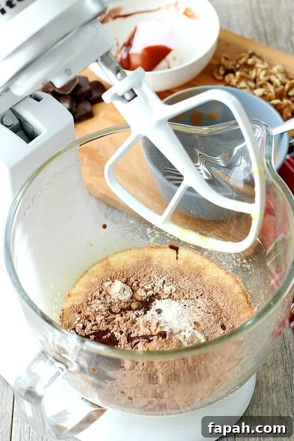 Christmas Chocolate Drop Cookies ingredients Christmas Chocolate Drop Cookie ingredients in a mixing bowl getting ready to be blended.
