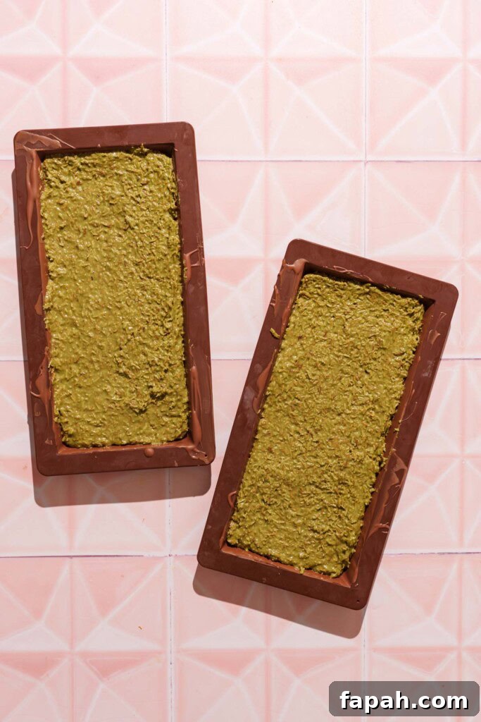 Dubai-Style Chocolate Bar Recipe: Homemade Candy Bar Guide 11 Pistachio cream filled in the chocolate mold.