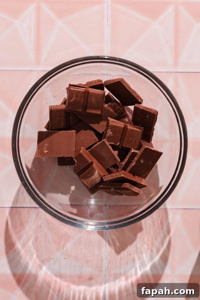 Dubai-Style Chocolate Bar Recipe: Homemade Candy Bar Guide 6 Chocolate pieces in a bowl.