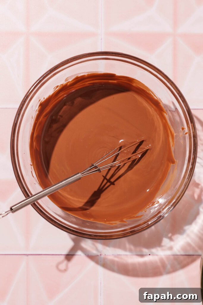 Dubai-Style Chocolate Bar Recipe: Homemade Candy Bar Guide 7 Melted chocolate in a bowl.