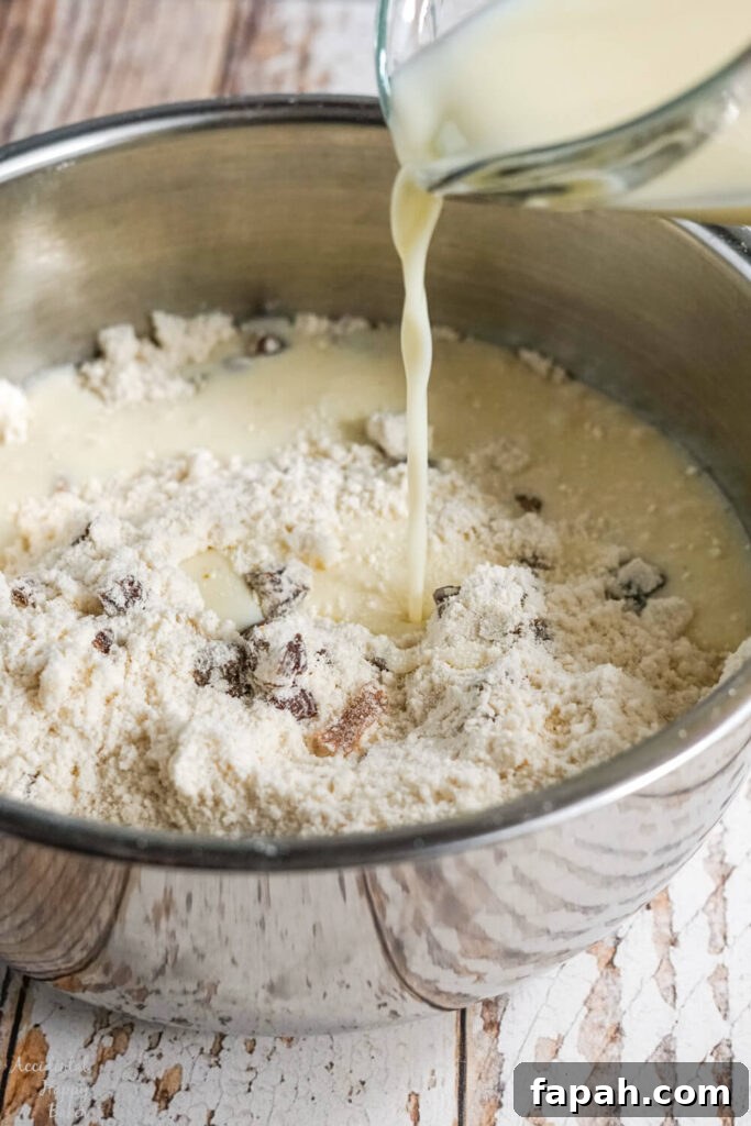 Milk, egg, and vanilla are poured over the top of the dry ingredients.
