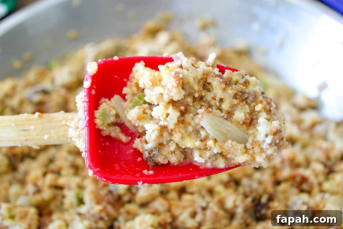 Uncooked dressing on a red spoon.
